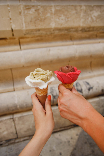 Two People Holding Ice Creams Two People Holding Ice Creams