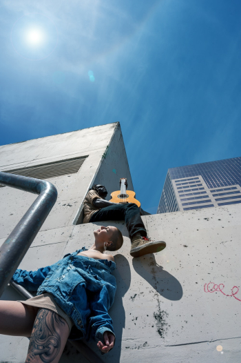 Two People on Concrete Building Two People on Concrete Building