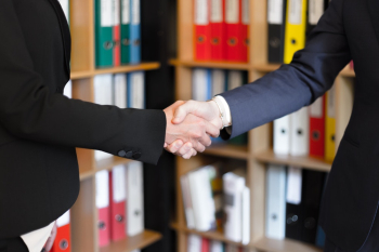 Two People Shaking Their Hands Two People Shaking Their Hands