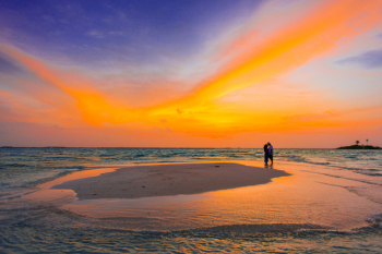 Two People Standing Near Seashore Two People Standing Near Seashore
