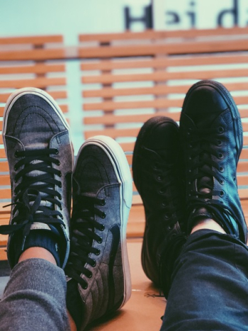 Two People Wearing Black Sneakers Two People Wearing Black Sneakers