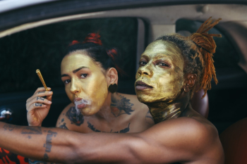 Two People With Gold Face Paint Two People With Gold Face Paint