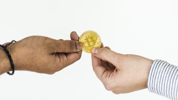 Two Person Holding Bitcoin Two Person Holding Bitcoin