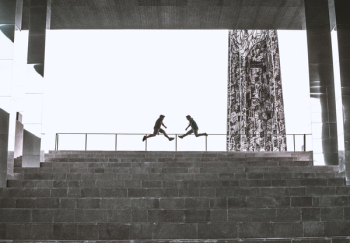 Two Person Jump Near Railings Two Person Jump Near Railings