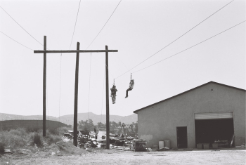 Two Persons Working On Electric Cables Near Building Two Persons Working On Electric Cables Near Building