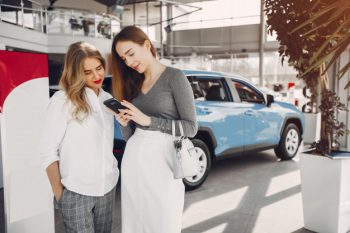 Two stylish women in a car salon Free Photo Two stylish women in a car salon Free Photo