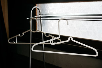 two white clothes hangers two white clothes hangers
