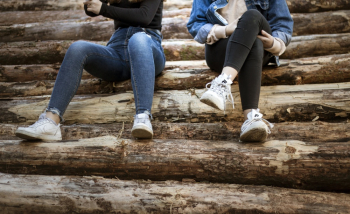 Two Women Sitting Side by Side Two Women Sitting Side by Side