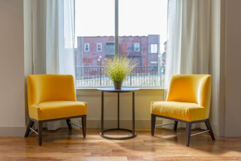 two yellow padded chairs two yellow padded chairs