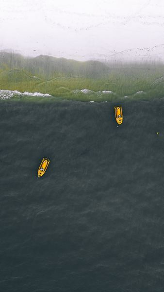 two yellow personal watercraft on water two yellow personal watercraft on water