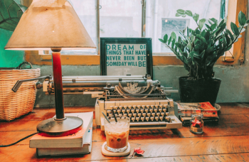 Typewriter Beside Table Lamp on Table Typewriter Beside Table Lamp on Table