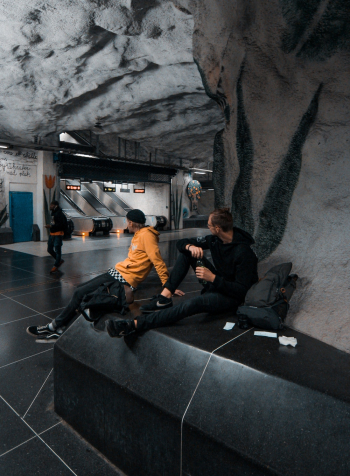 Unknown Men Sitting Indoors