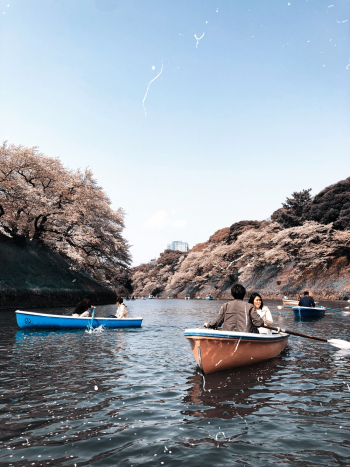 Unknown People Riding on Boats Unknown People Riding on Boats