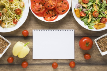 Vegan goodies and notebook mock-up Free Photo