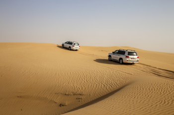 Vehicles Traveling in a Desert Vehicles Traveling in a Desert