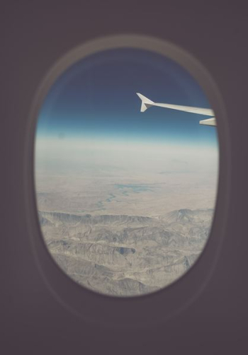 view of mountains from airplane window view of mountains from airplane window