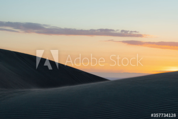 View of sand dunes during sunrise View of sand dunes during sunrise