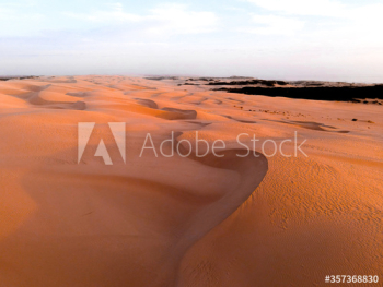 View of sand dunes during sunset View of sand dunes during sunset