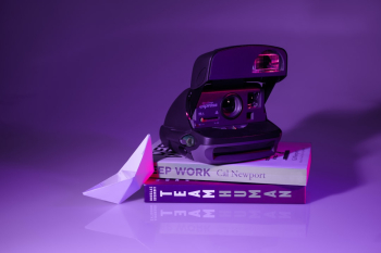 Vintage polaroid on top of amazing books. Vintage polaroid on top of amazing books.