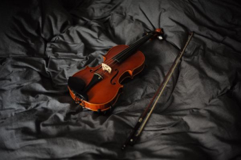 violin with bow on cloth violin with bow on cloth