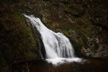 waterfall on green rocks waterfall on green rocks