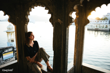 Western woman sitting on a cultural architect.. | Free stock photo - 543717 Western woman sitting on a cultural architect.. | Free stock photo - 543717