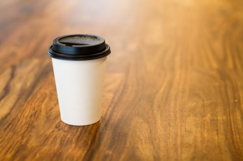 white and black plastic cup
