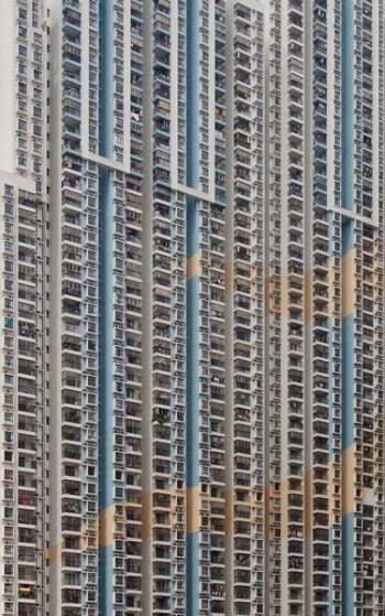 white and brown concrete apartment building white and brown concrete apartment building
