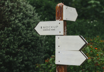 White and Brown Wooden I Mock Up Signage Near Bush