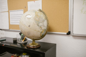 White and Gold Desk Globe on Black Table