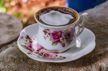 White and Pink Ceramic Floral Teacup With Saucer
