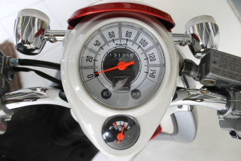 White and Red Motorcycle Gauge