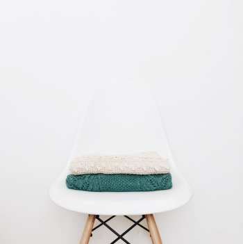 white and teal textile on white stool white and teal textile on white stool