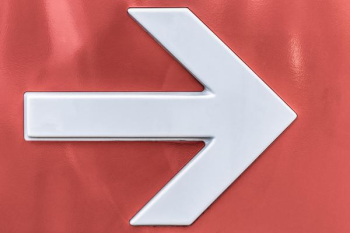 white arrow sign of wall white arrow sign of wall