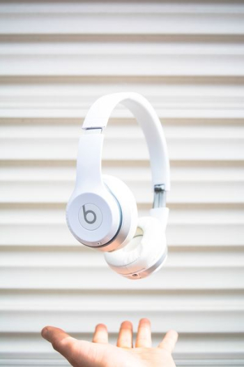 white Beats by Dr. Dre headphones on mid air white Beats by Dr. Dre headphones on mid air