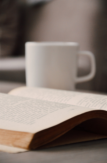 White Book Beside White Mug White Book Beside White Mug