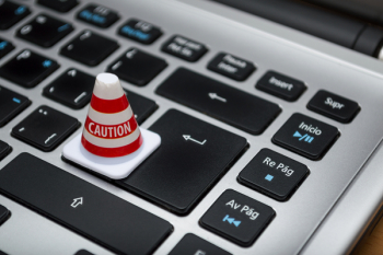 White Caution Cone on Keyboard White Caution Cone on Keyboard