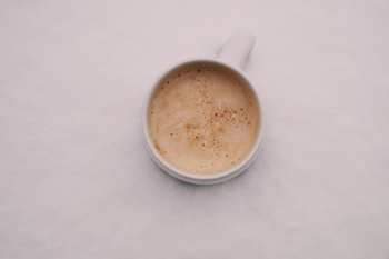 White Ceramic Cup Filled With Brown Liquid White Ceramic Cup Filled With Brown Liquid