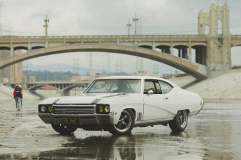 White Coupe on Body of Water Near Bridge White Coupe on Body of Water Near Bridge