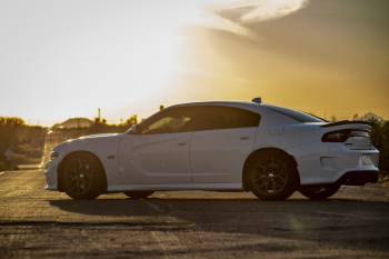 White Dodge Charger Parked On Road White Dodge Charger Parked On Road