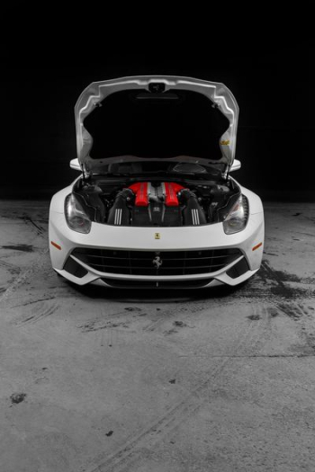 white Ferrari vehicle park white Ferrari vehicle park