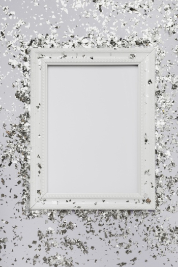 White frame mock-up with copy space and glitter Free Photo