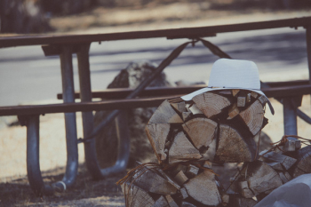 White Hat on Brown Firewood White Hat on Brown Firewood