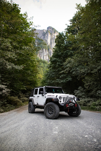 White Jeep Wrangler on Asphalt Road White Jeep Wrangler on Asphalt Road