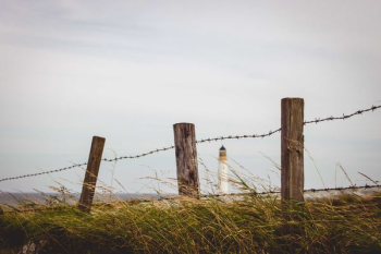 white lighthouse at distance white lighthouse at distance