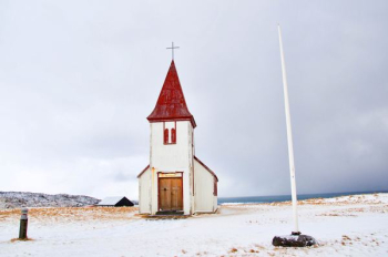 white pole near white and red chapel white pole near white and red chapel