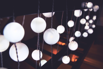 White String Lights on Black Hand Rail White String Lights on Black Hand Rail