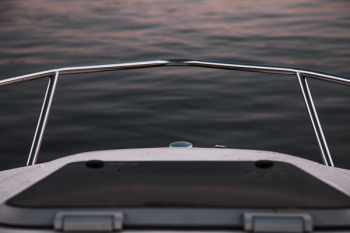 White Watercraft on Body of Water White Watercraft on Body of Water