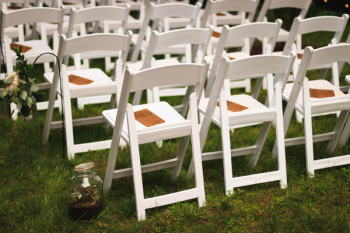 White Wooden Chairs on Green Grass Field White Wooden Chairs on Green Grass Field