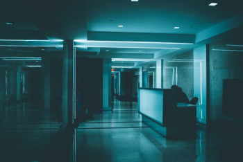 white wooden desk on hallway inside building white wooden desk on hallway inside building